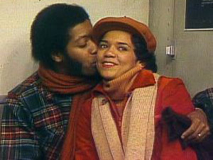 David kisses Maria on the cheek in a 1970s episode of Sesame Street.