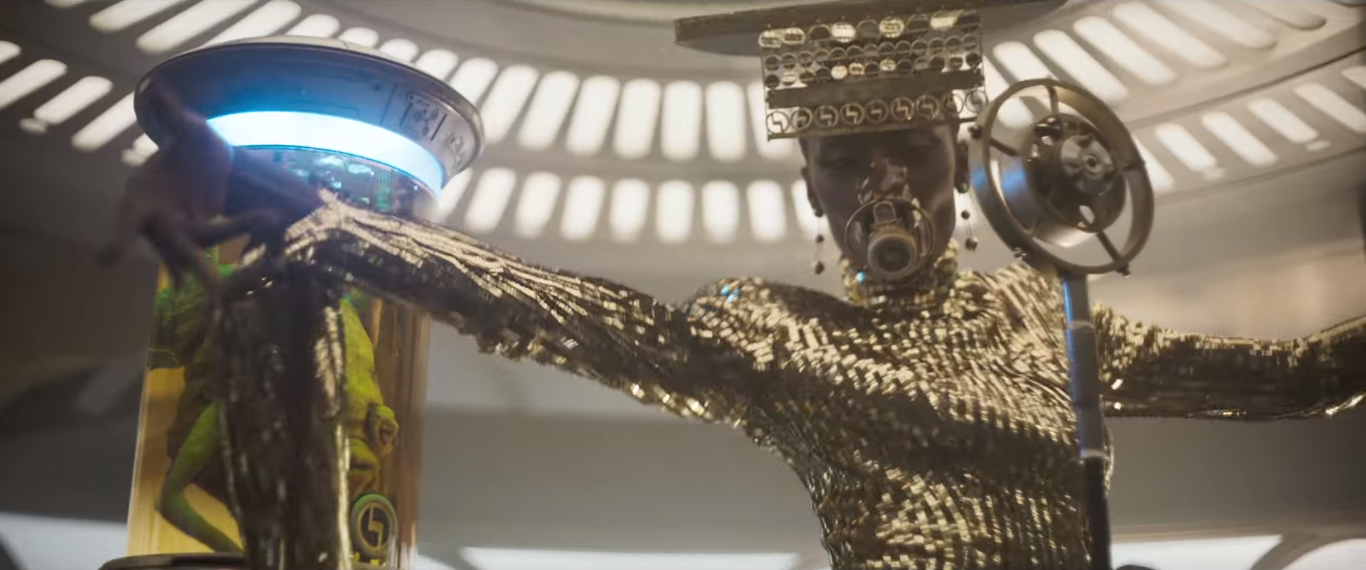 Image of black woman in a gold costume in Solo: A Star Wars Story