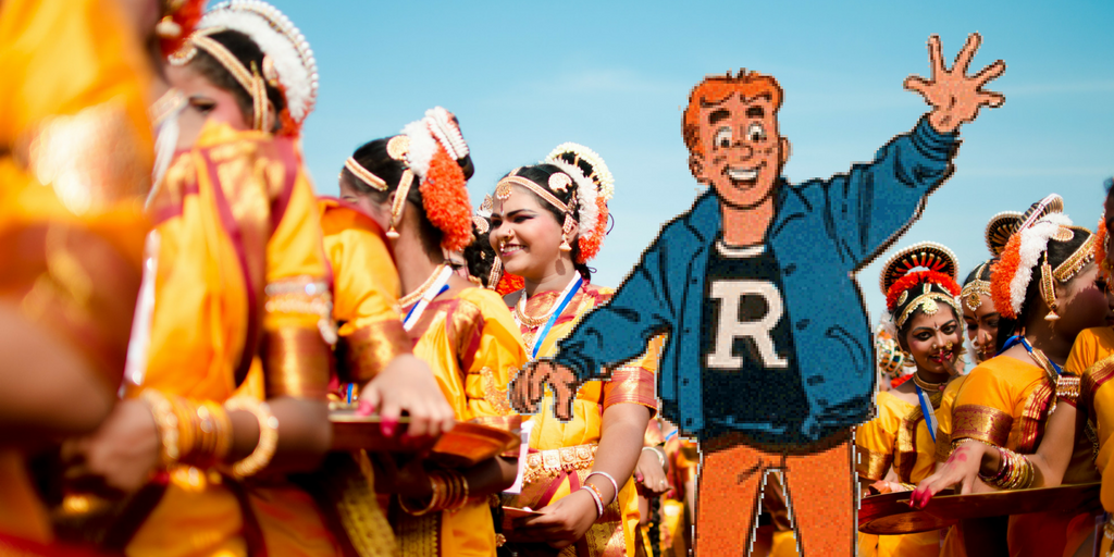 Illustration featuring a drawn image of Archie Andrews among Indian dancers.
