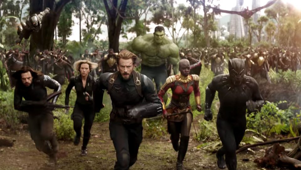 Winter Soldier, Black Widow, Captain America, Okoye, Black Panther and the Hulk are running with Wakanda's forces through the Wakandan Savannah towards danger.