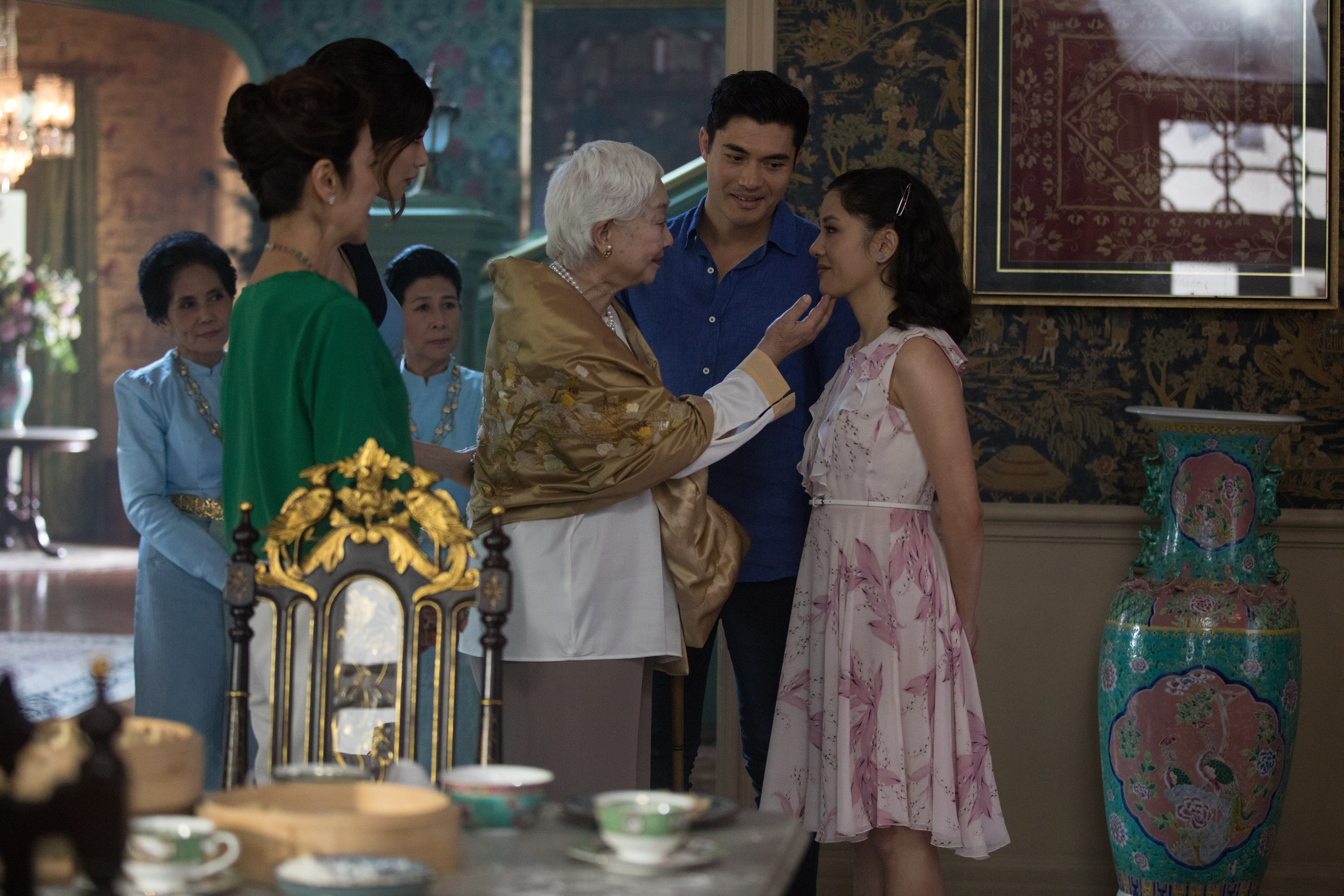 (L-R) MICHELLE YEOH as Eleanor, GEMMA CHAN as Astrid, LISA LU as Ah Ma, HENRY GOLDING as Nick and CONSTANCE WU as Rachel in Warner Bros. Pictures' and SK Global Entertainment's contemporary romantic comedy "CRAZY RICH ASIANS," a Warner Bros. Pictures release. Photo Credit: Courtesy of Warner Bros. Pictures