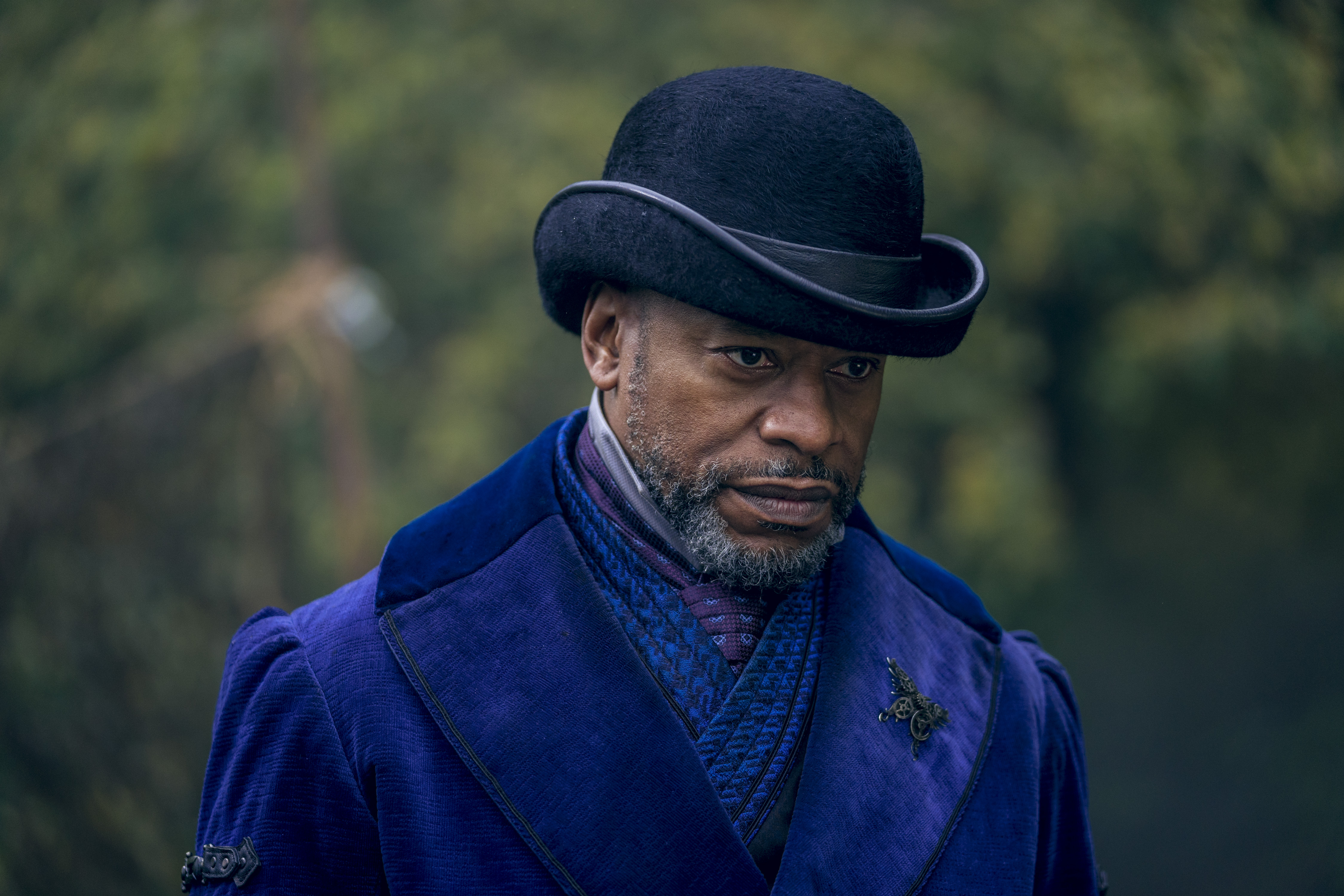 Sherman Augustus as Moon. wearing a dark blue bowler hat and a blue velvet overcoat with an iron butterfly pin.  (Photo Credit: Aidan Monaghan/AMC)