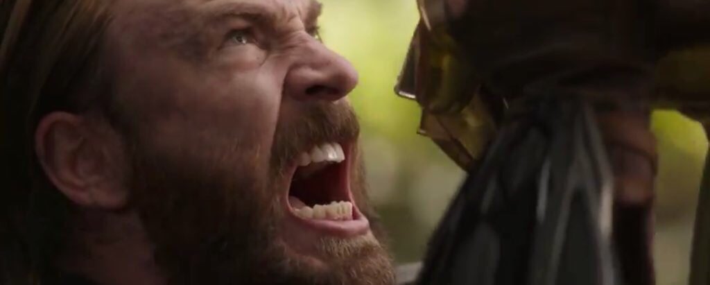Captain America attempting to hold back Thanos' gauntlet. 