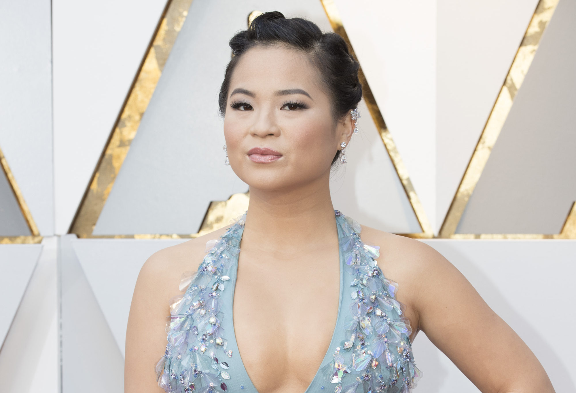 Kelly Marie Tran in a light blue gown with plunging halter neckline at the 2018 Oscars.