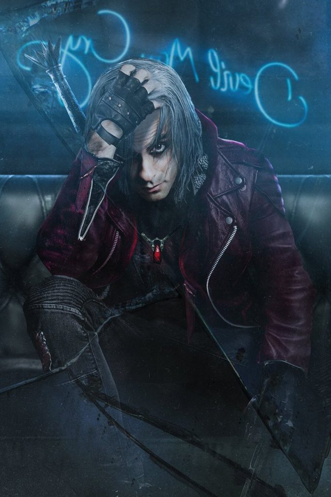 Adi Shankar as Dante from Devil May Cry. A neon sign for Devil May Cry is in the background. 
