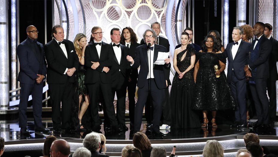 The cast and crew of Green Book accept their award. 
