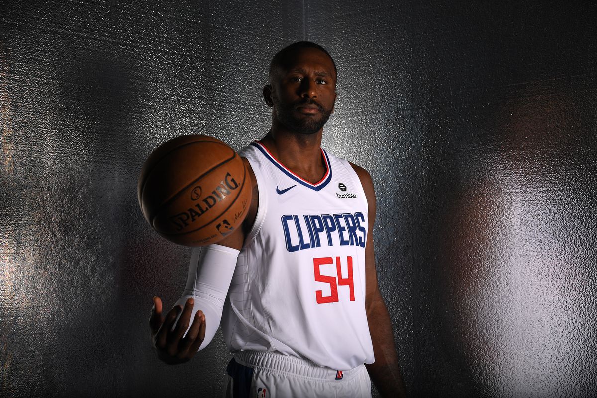 Patrick Patterson in his LA Clippers jersey tosses a basketball