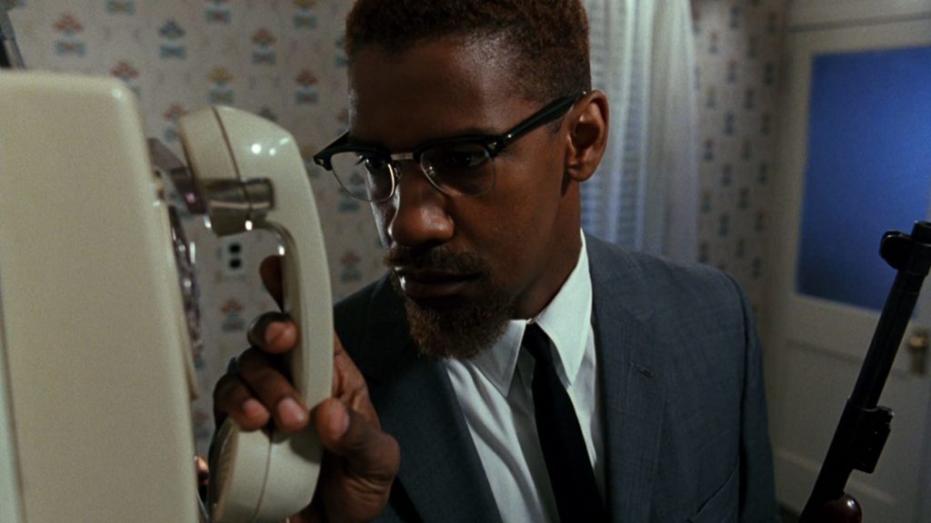 Denzel Washington in Malcolm X. Photo credit: 40 Acres and a Mule Filmworks, Warner Bros. This is one of the 30 films Redbox recommends to learn about systemic racism. 