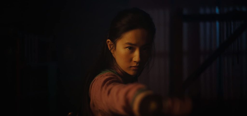 Yifei Liu as Mulan, brandishing a sword. Mulan can inspire young girls around the world. (Photo credit: Disney)
