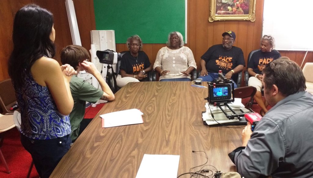 (L-R) The crew of Far East Deep South, Larissa Lam, director, Patrick Wilkerson, camera, and Jason Rochelle, camera film residents of Pace, MS, discussing the important relationship between the African-American and Chinese communities in the Mississippi Delta