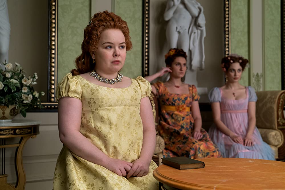 Penelope Featherington (Nicola Coughlan) with her sisters Prudence (Bessie Carter) and Philipa (Harriet Cains). (Photo credit: Liam Daniel/Netflix)