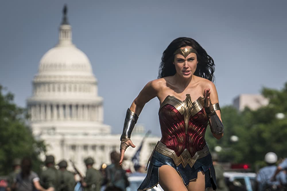 Gal Gadot as Diana running toward a national threat. (Photo credit: Warner Bros.)