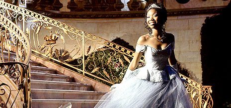 Brandy as Cinderella, posing on the stairs of the castle. (Photo credit: Disney)