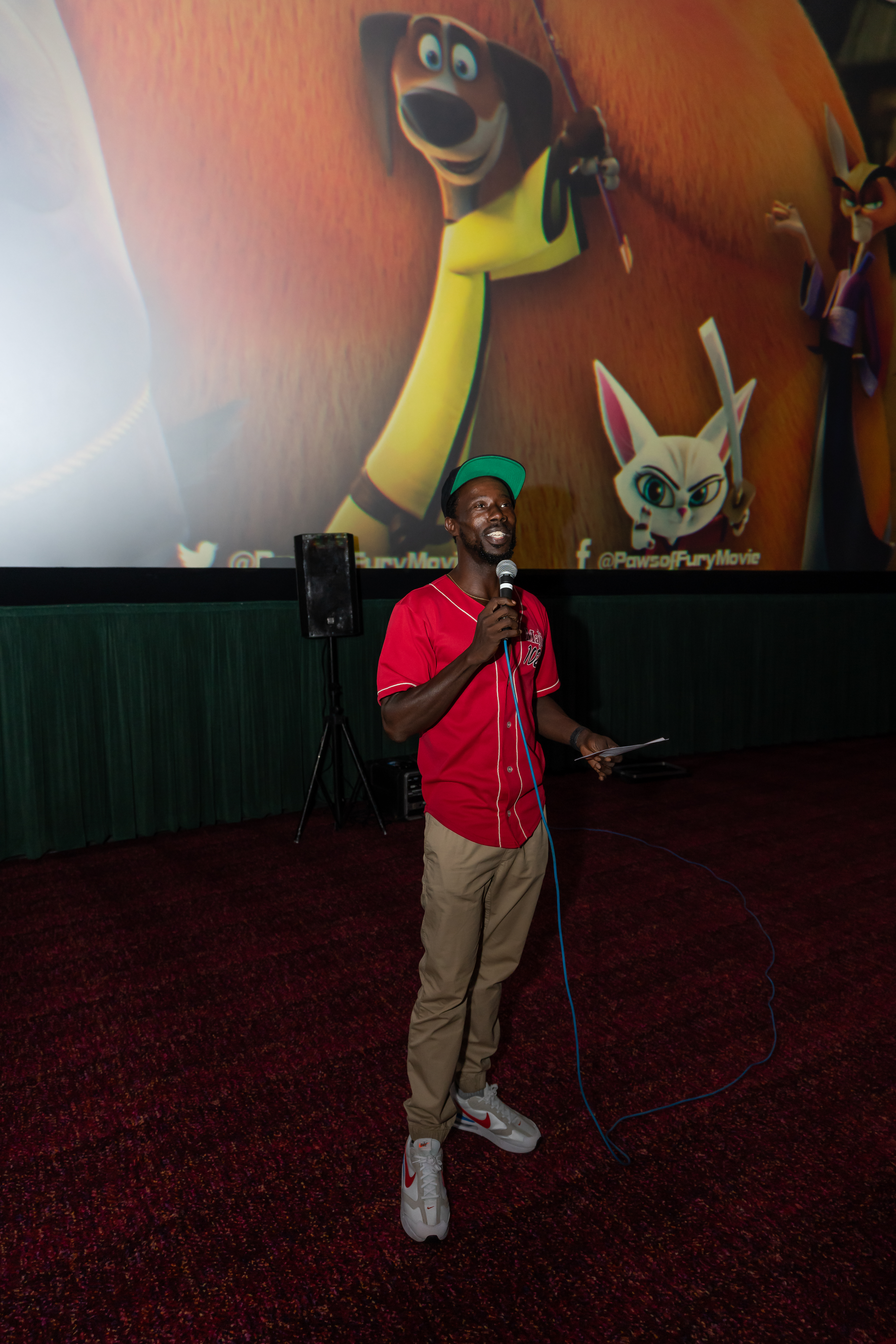 Ready To Love's KG Smooth welcomes guests at Paws of Fury screening in Houston. (Photo credit: Andre Kelly)