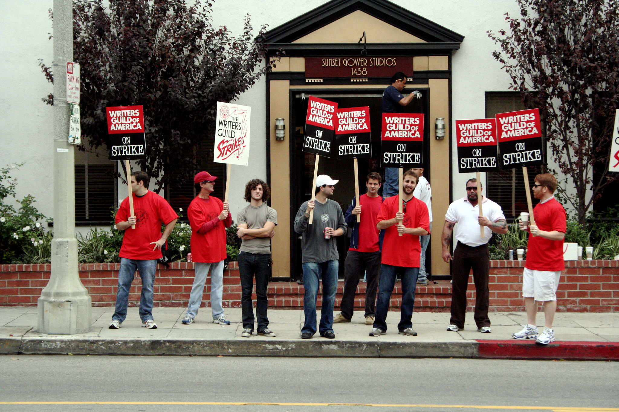 Writers strike picketers outside of the Sunset Gower Studio in Hollywood, CA. (Christy Macintosh/Flickr/Creative Commons)