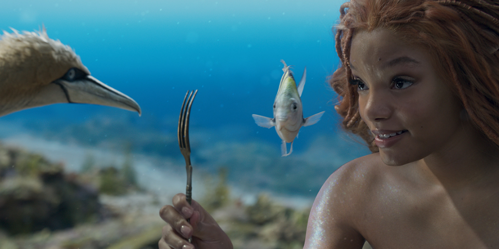 Scuttle (voiced by Awkwafina) and Flounder (voiced by Jacob Tremblay) talk with Ariel (Halle Bailey). (Photo credit: Disney)